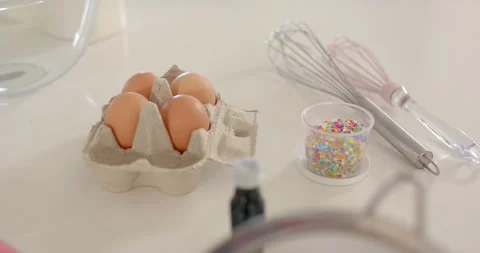 Vertical video: Camera moving showing four eggs in carton in kitchen for baking, Stock Footage 338063991