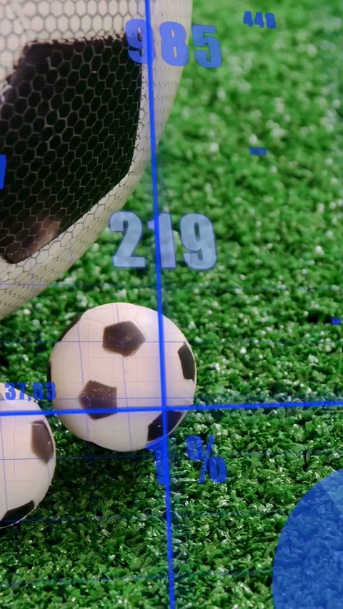 Vertical video: Camera panning causing soccer balls entering while HUD showing Stock Footage 333487394