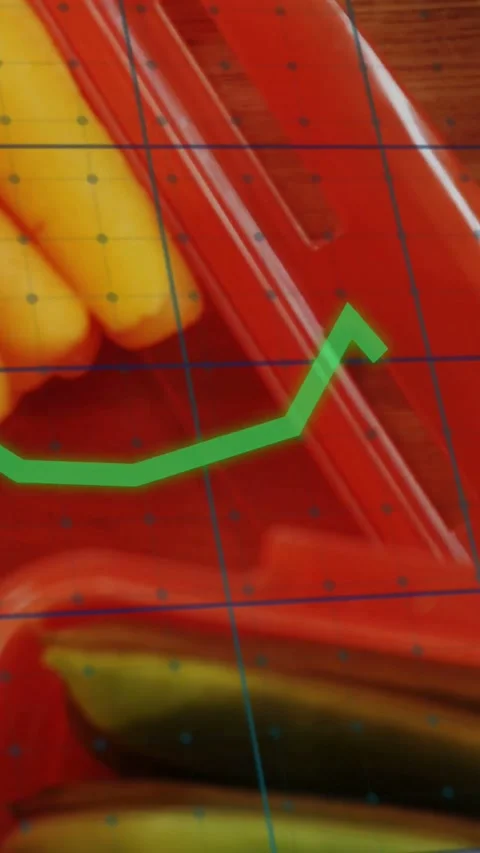 Vertical video: Camera panning down revealing red tray, green graph moving over Stock Footage 334317950