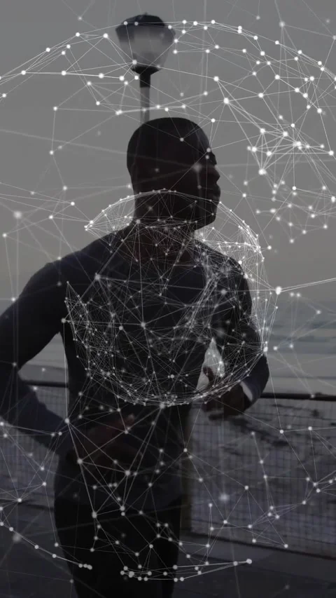 Vertical video: Camera panning following man jogging pier, node mesh orbiting Video stock 330965248