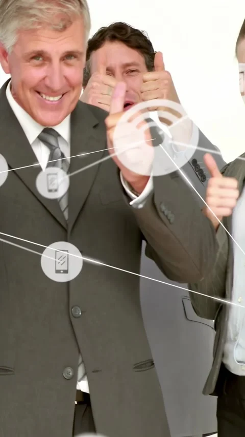Vertical video: Camera panning group, exec giving thumbs, nodes over faces Stock Footage 334381987