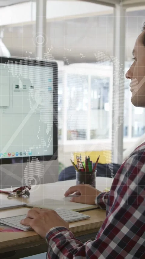 Vertical video: Camera panning, hands typing, worker moving mouse, reviewing Video stock 333079703