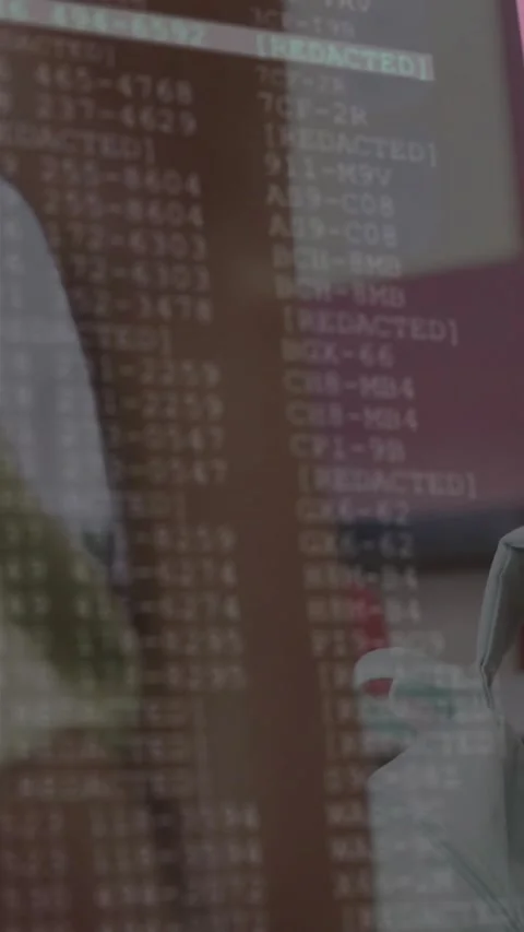 Vertical video: Camera panning left, girl resting chin while code overlay Stock Footage 331238520