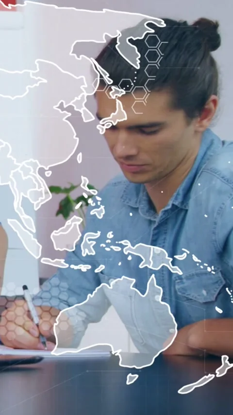 Vertical video: Camera panning, man in denim taking notes for business under Stock Footage 331759726