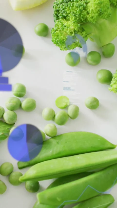 Vertical video: Camera panning revealing greens while blue charts fading and Stock-Footage 328398434