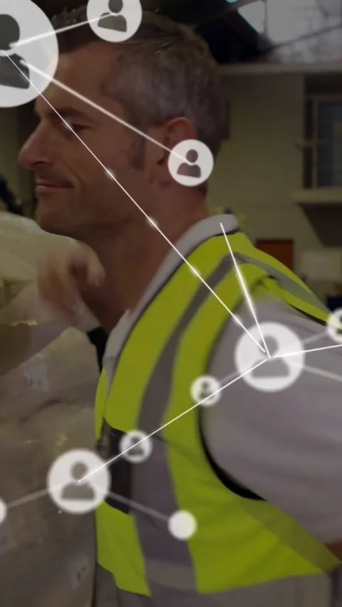 Vertical video: Camera panning revealing warehouse worker turning, icons linking Stock Footage 334602647