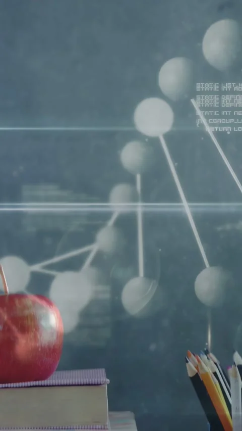 Vertical video: Camera panning revealing books, apple, cup as molecule overlay Stock Footage 334770503