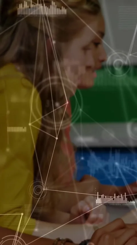 Vertical video: Camera panning showing class typing at lab PCs HUD overlaying Stock Footage 331333899
