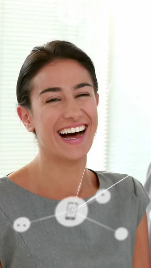 Vertical video: Camera panning woman in grey turning, laughing overlay linking Stock Footage 334598505