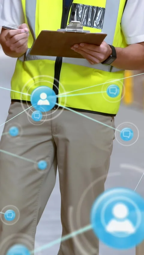 Vertical video: Camera panning to worker in warehouse blue nodes linking as he Video stock 329840970
