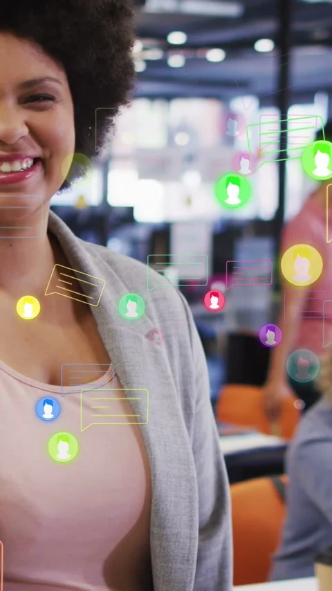 Vertical video: Camera pullback revealing female worker, chat icons drifting, Stock Footage 333978149