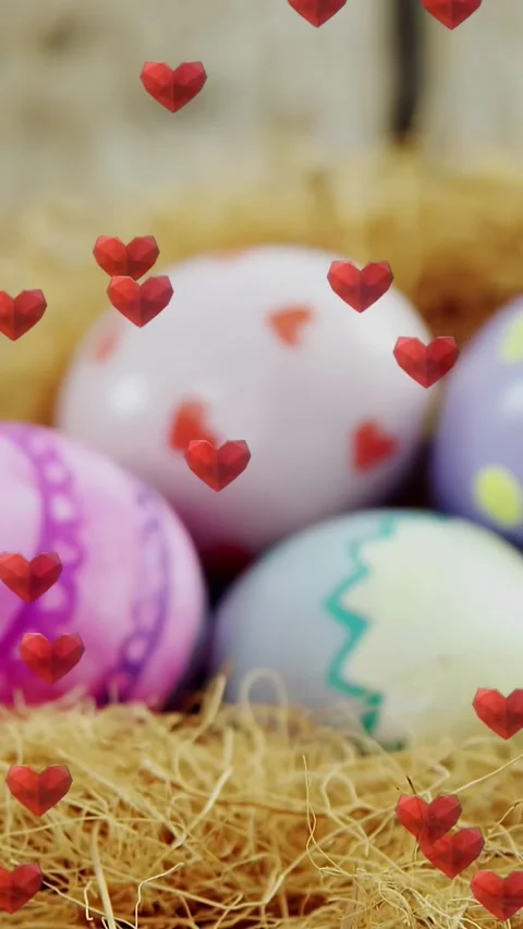 Vertical video: Camera pulling back revealing decor eggs in nest, hearts Stock Footage 331009433