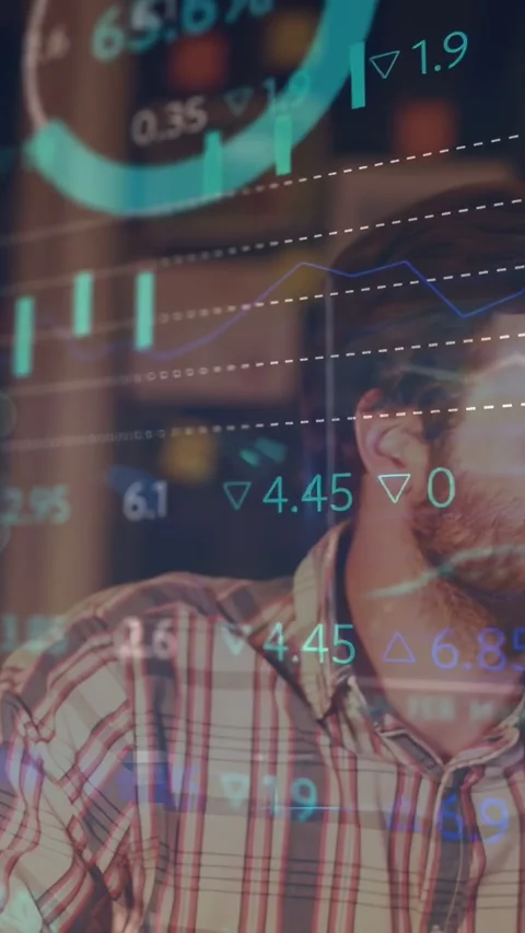 Vertical video: Camera revealing trader, financial charts animating while he Stock Footage 334387146