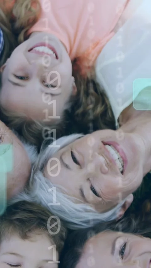 Vertical video: Camera rotating, family on grass smiling, binary fading over Stock Footage 332644769