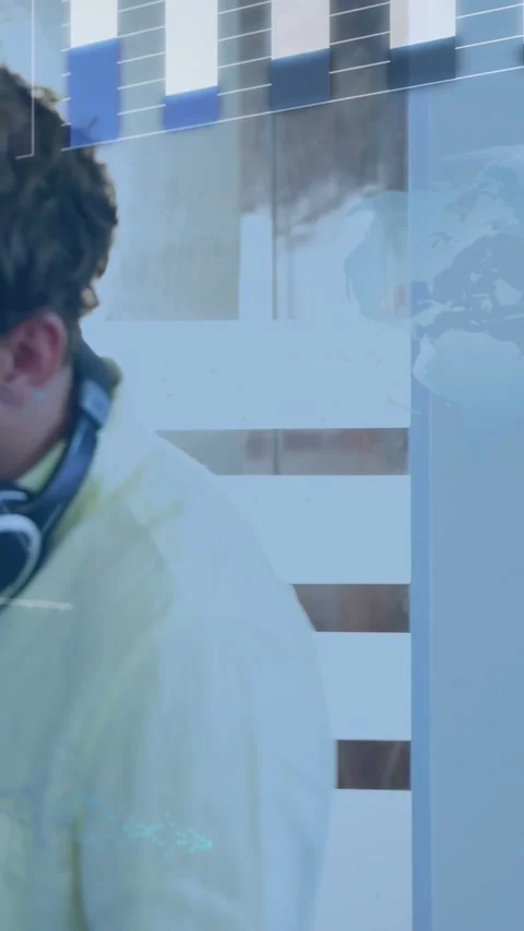 Vertical video: Camera shifting and revealing holo code map, man with headset Stock Footage 332594770