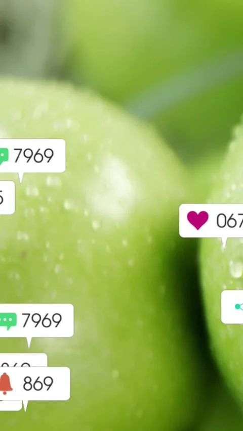 Vertical video: Camera shifting, icons popping and clustering on green apples, Stock Footage 333836141