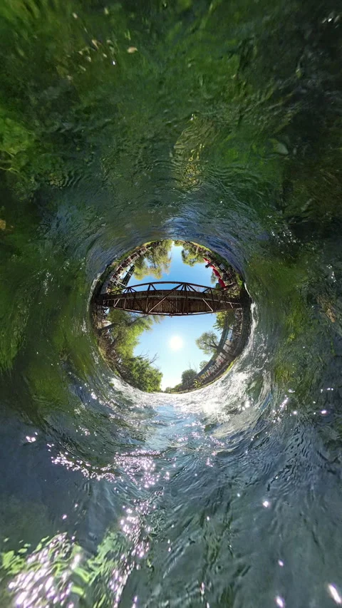 Vertical video. The camera transitions from a Tiny Planet effect to a wide-angle Video stock 289794577