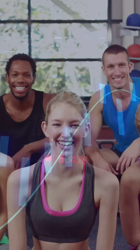 Vertical video: Camera zooming causing lead woman giving two thumbs in gym as Stock Footage 334381873