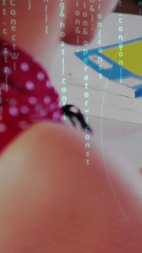 Vertical video: Camera zooming in, starting code overlay across student torso, Video stock 331738989