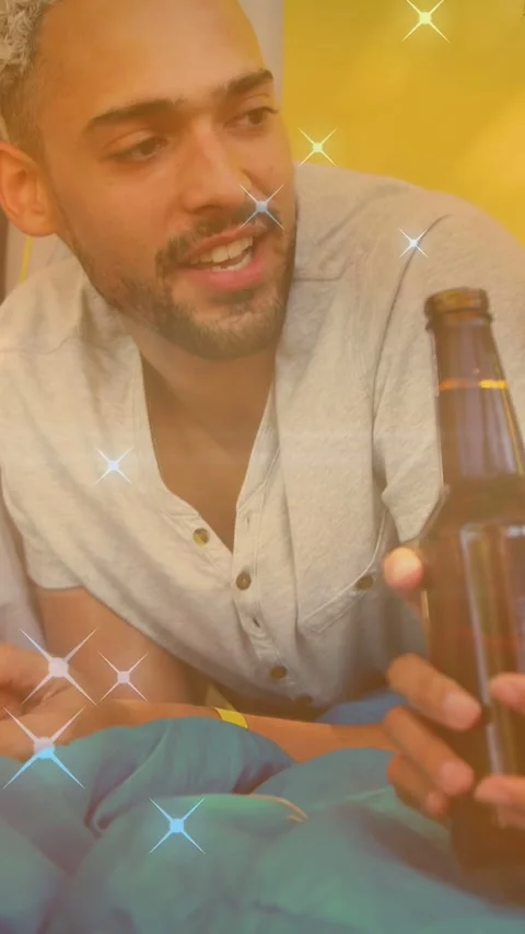 Vertical video: Camper speaking as bottle enters, causing handing to friend, 스톡 동영상 333953537