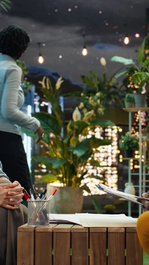 Vertical video Candidate evaluation during job interview in rooftop lounge Stock Footage 347814057