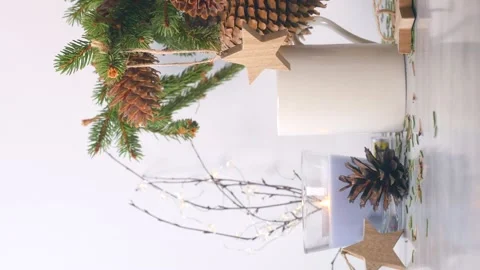 Vertical video. Candle light, star hanger moving on fir tree branches christmas Stock Footage 144250891