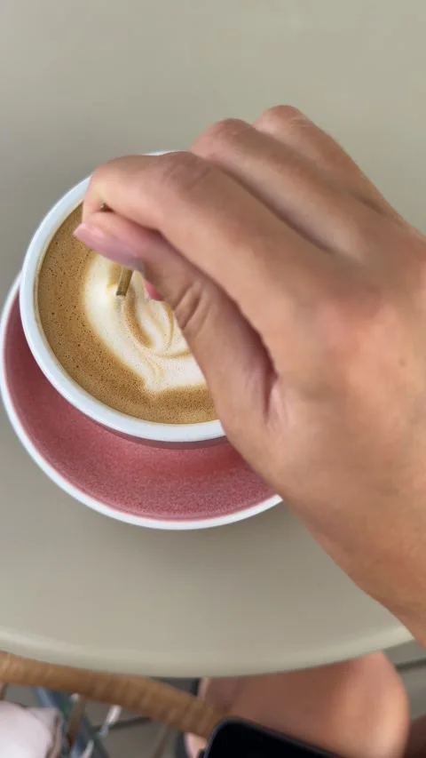 Vertical video of cappuccino in a pink cup Stock Footage 346415429