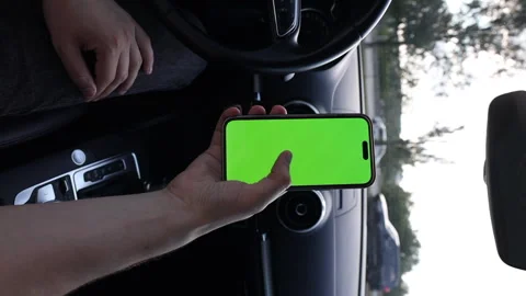 Vertical video Captivating Moments of a Hand Holding a Smartphone with a Bright Stock Footage 314460188