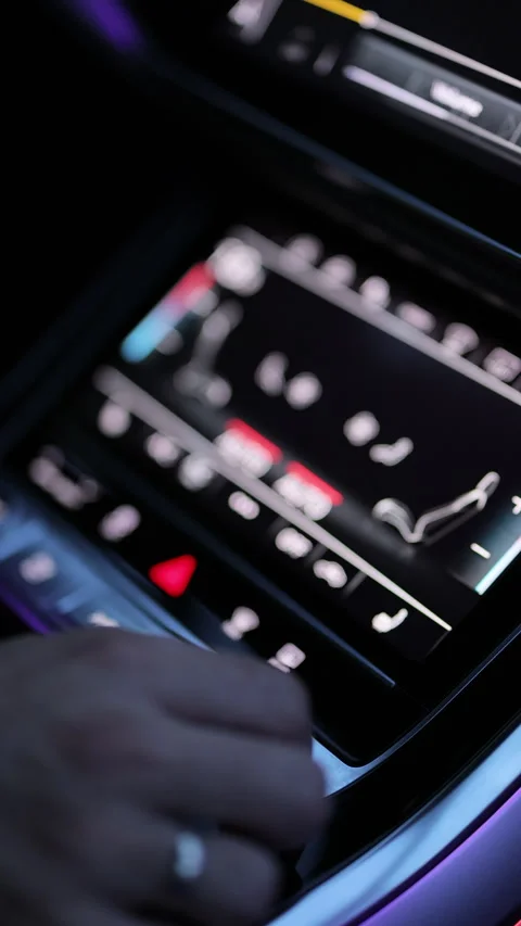 Vertical video of car dashboard volume knob. Drivers hand adjusts volume control Stock Footage 335945267