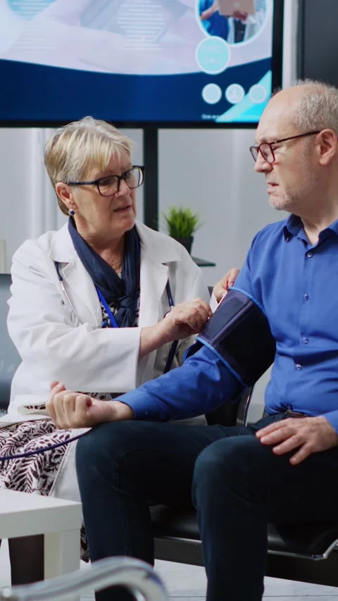 Vertical video: Cardiologist measuring m... | Stock Video | Pond5