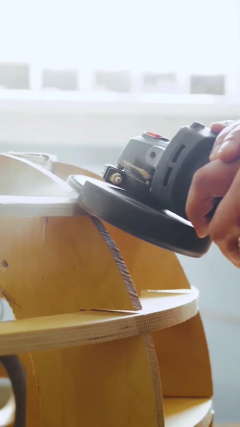 Vertical video. Carpenter sands and polishes wood close-up. Upholstered Stock Footage 323451300