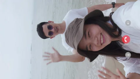 Vertical video: Caucasian couple greets friend and family video call. Stock Footage 155557385