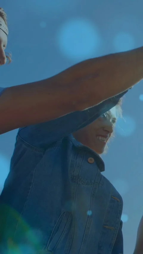 Vertical video: Center in denim lifting arm, causing animated bottle popping, Stock Footage 333953557