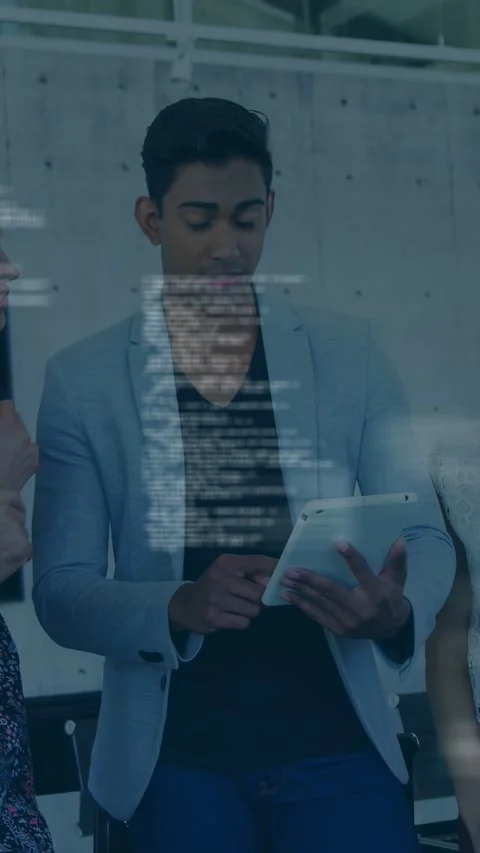 Vertical video: Central man tapping tablet and guiding team through tech demo Stock Footage 334792672
