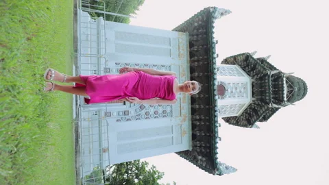 Vertical Video. Charming Well-Dressed Asian Woman Against Background of Thai Stock Footage 263739878