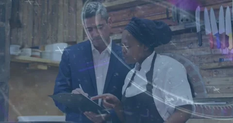 Vertical video: Checking boss in suit noting clipboard as chef in apron pointing Stock-Footage 331614429
