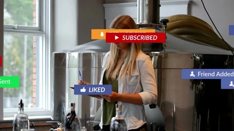 Vertical video: Checking staff in denim noting clipboard, pen in brewery as Stock Footage 333034693