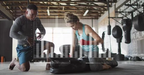 Vertical video: Checking timer coach starting trainee in tank red wraps hitting Stock Footage 330444481