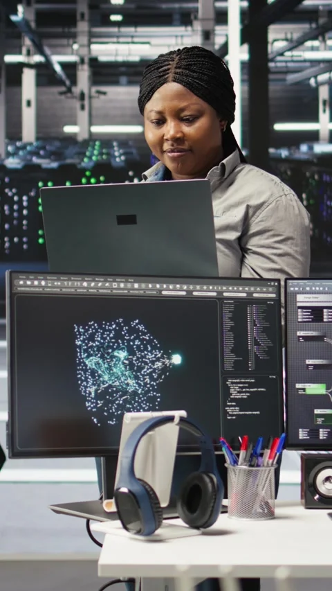 Vertical video Cheerful data center employee using node tree software to analyze Stock Footage 307969568