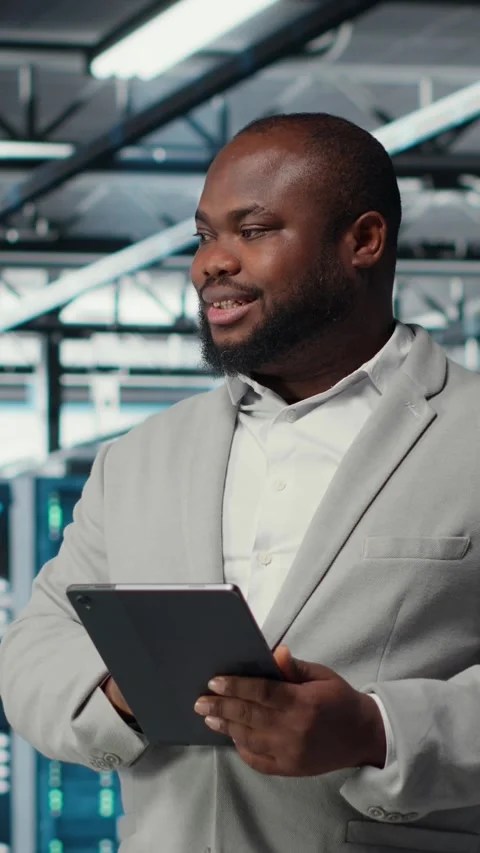 Vertical video Cheerful data center programmer looking at code debugging tools Stock Footage 311411859