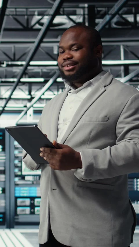 Vertical video Cheerful data center programmer looking at code debugging tools Stock-Footage 311546242
