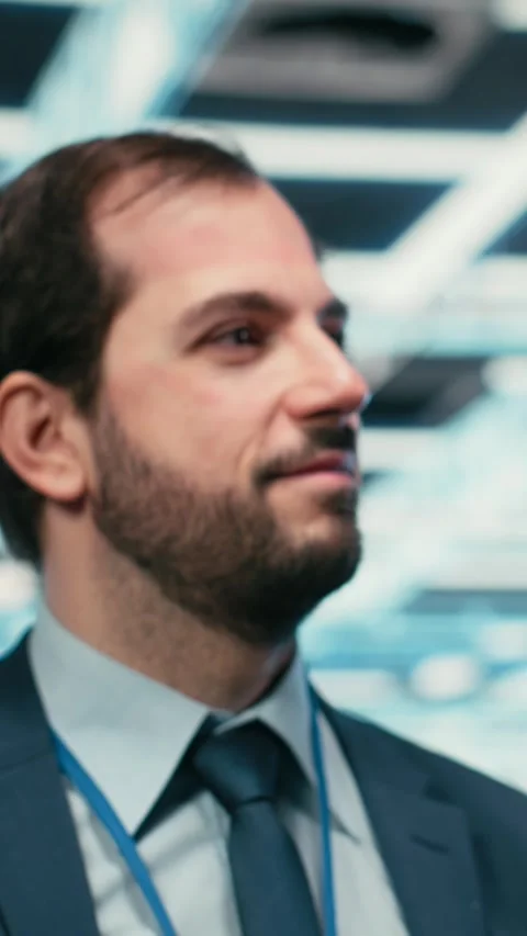 Vertical video Cheerful data center technician removing VR goggles after Stock Footage 329451015