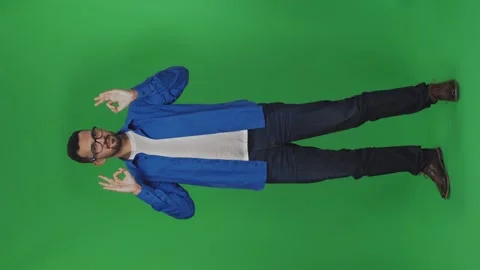 Vertical video of cheerful man performs simple dance making cool approve gesture Stock Footage 246292887