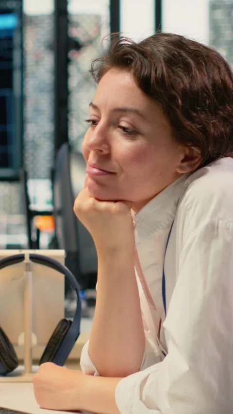 Vertical video Cheerful technician working in office, using AI specialized Stock Footage 323330464