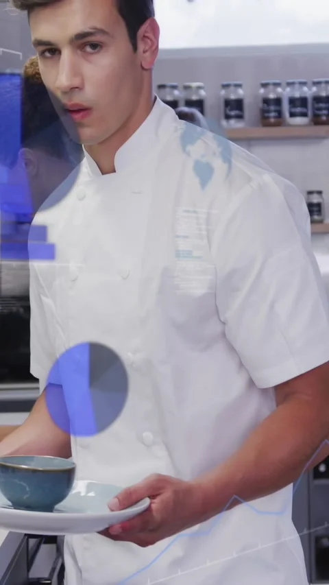Vertical video: Chef plating blue bowl in kitchen, data overlays appearing Stock Footage 333109583