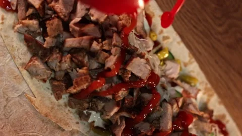 Vertical Video - Chef Pouring Ketchup on Shawarma Stock Footage 247136436