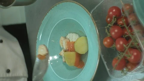Vertical video. Chef prepares a dish for serving, concept of cooking Stock Footage 105580579