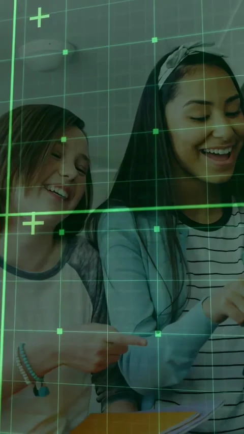 Vertical video: Child pointing nudging teen tapping tablet sharing notes in Stock Footage 332381937