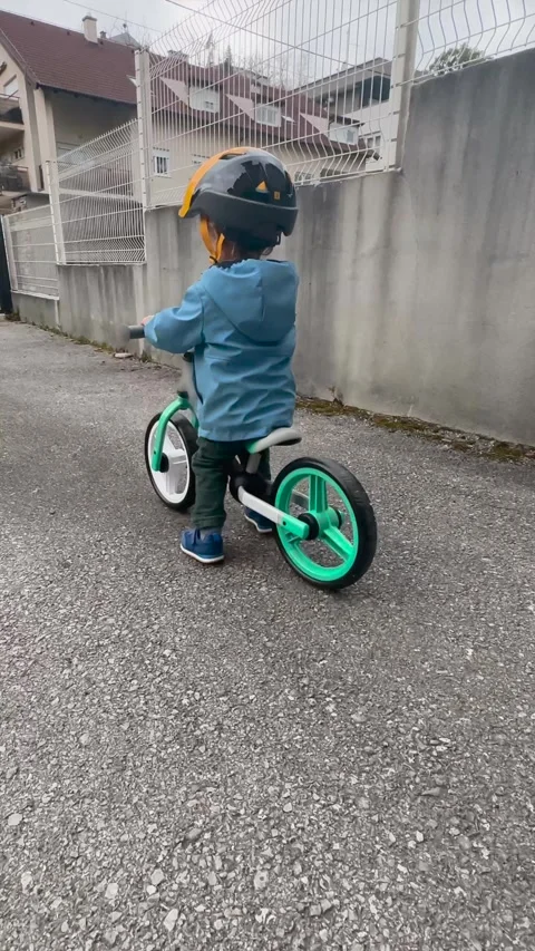 Vertical Video of Child Riding Bicycle Outdoors Stock Footage 345164321