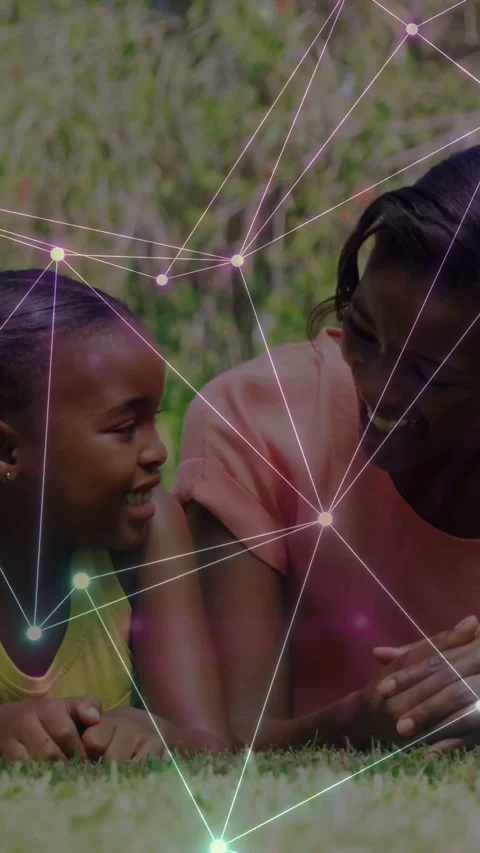 Vertical video: Child turning toward woman on grass, node network linking faces Stock Footage 337541064